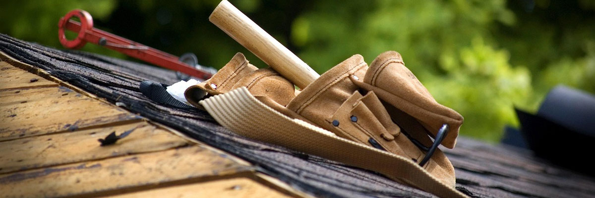 a toolbelt full of tools on a new roof